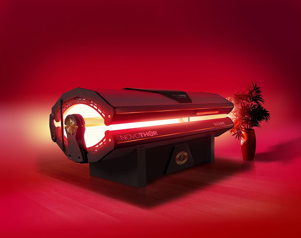 Professional NovoTHOR Red Light Therapy treatment bed in modern wellness facility